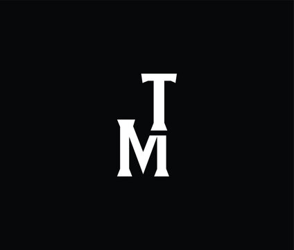 White letters T and M on black background  simple typography