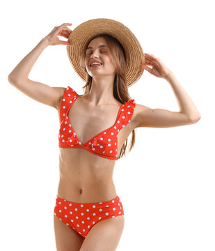 Beautiful woman wearing stylish swimsuit and hat on white background