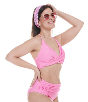 Woman in pink swimsuit and sunglasses on white background