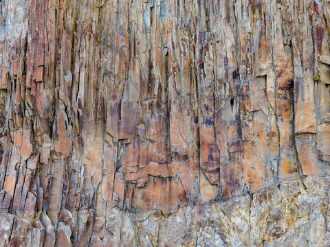 Weathered Basalt Cliff Wall With Columnar Rock Formations in BC Canada Coastal Landscape