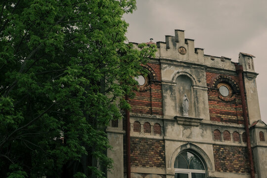 Elegant historic villa Palatyn in Lviv, Ukraine, featuring refined European architecture with decorative facade elements, large windows, and classical proportions. 