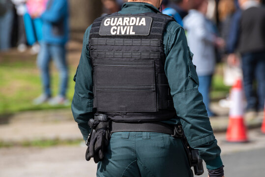 Guardia Civil officer standing on a city street The Concept of order and security