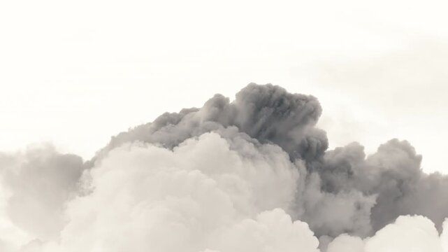 Timelapse video of clouds swelling and evolving in the sky captured using infrared technique. High contrast and surreal tones emphasize atmospheric movement, weather formation and dramatic natural
