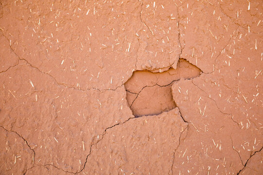 Cracked adobe wall texture background