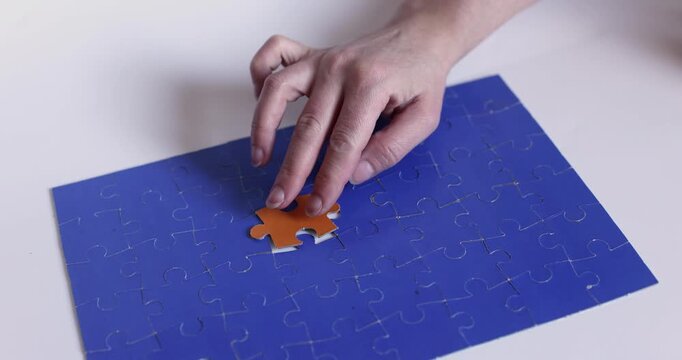 Blue puzzle piece on a surface, symbolizing problem-solving