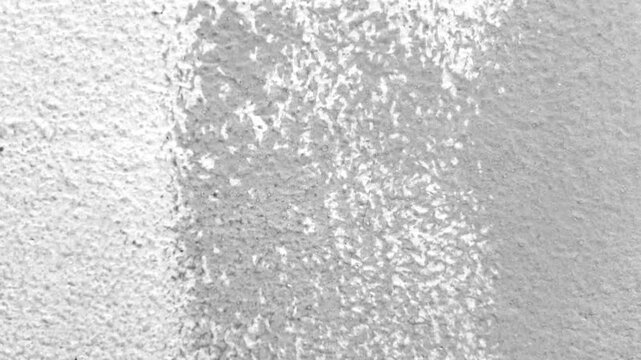 Abstract white background animation of a grunge textured old paper. 4K Seamless loop.	