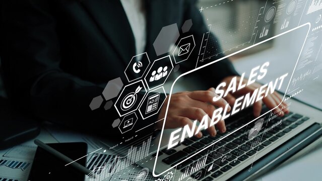 Professional Businessman Working on Laptop with Digital Sales Enablement Concept on Screen in Modern Office Setting. Asymptotic smart data analytic.