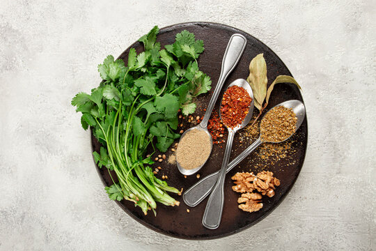 Georgian spices in spoons, on ketsi, top view, no people,