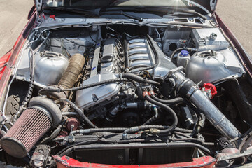 Fototapeta premium Exposed engine bay with clean, metallic components