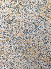 Fototapeta premium Terrazzo or pebble wash wall surface with beige and gray tones, speckled stone pattern, rough aggregate texture, for backgrounds, architecture projects, flooring, interior design, exterior uses.