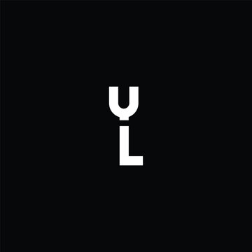A striking white abstract letter Y uppercase with a thin line on the bottom connecting to a lowercase letter L on the bottom