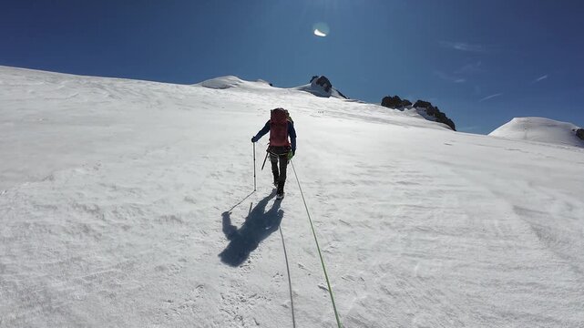POV mountaineering in rope team with mountaineers and mountain glacier panorama with summits Ludwigsh&ouml;he, Corno Nero (Schwarzhorn) and Balmenhorn in summer in Pennine Alps, Italy