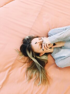 Dreamy Overhead Portrait on a pink background
