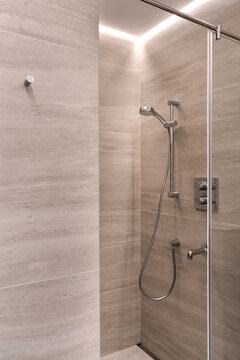 Bathroom in contemporary style with tiled walls