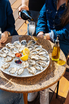 Group of People eating oysters outside