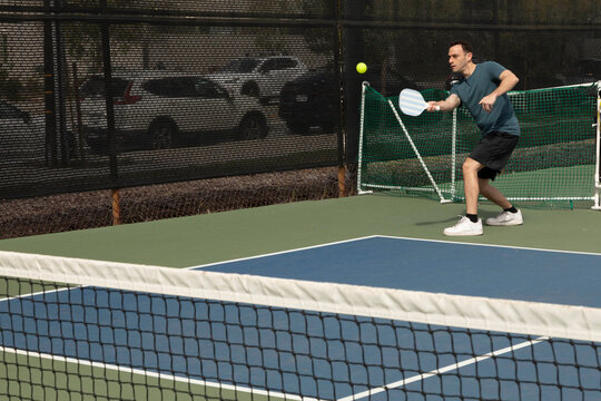 friends outside during a game of pickleball