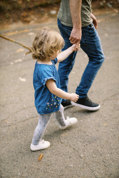 father and daughter outdoors on walk together