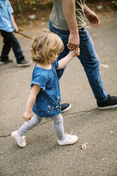 father and daughter outdoors on walk together