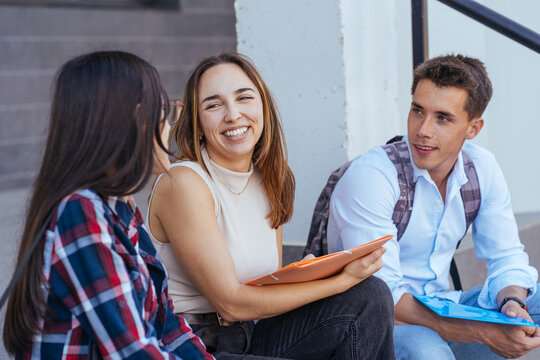 Content young students chatting during school break