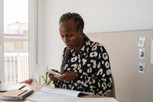 Female pilot preparing for the flight at home