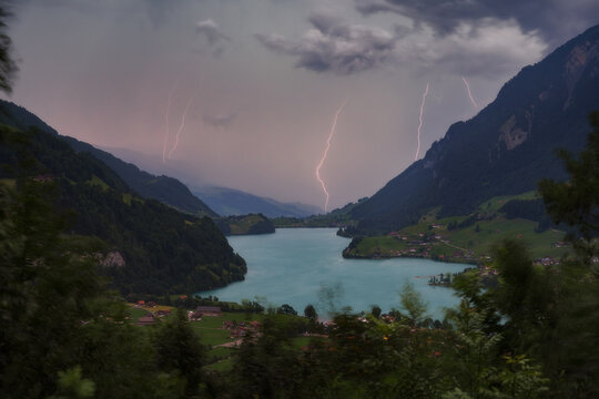 Lightning storm over Lungernersee lake and valley, Swiss Alps