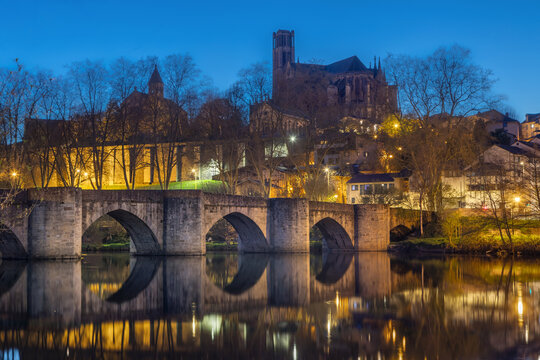 Limoges, France - view of historic Pont Saint Etienne bridge and Cathedral at dusk