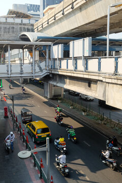 Tuk-tuks and Motorbikes Below Elevated Railway