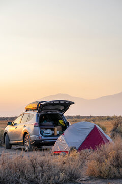 Dispersed camping tent setup by suv