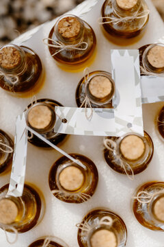 Elegant wedding decor featuring artisanal bottles in Italy