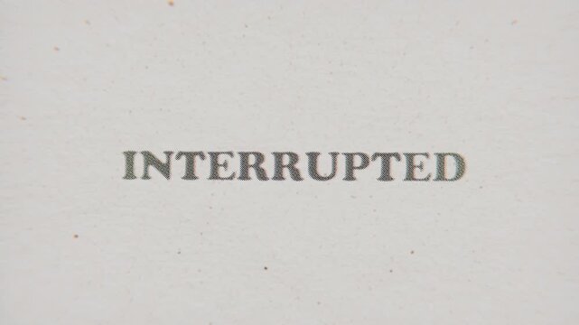 CMYK Halftone Text Interrupted Printed on Changing Paper with Vintage Stop Motion Effect.