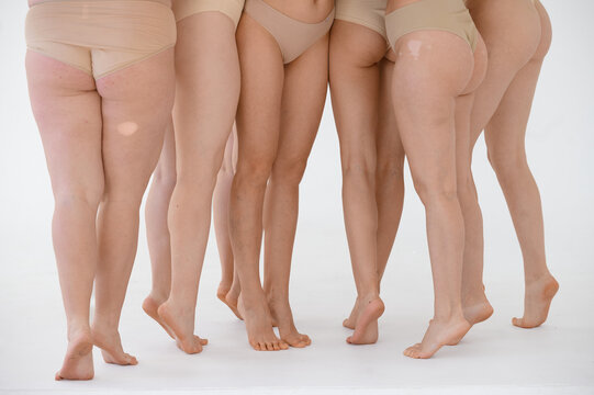 diverse women in white studio 