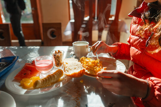 Woman eating Ecuadorian breakfast in the   hotel 