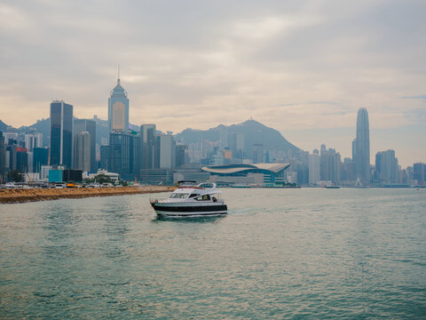 Boat on the background of Hong Kong cityscape 