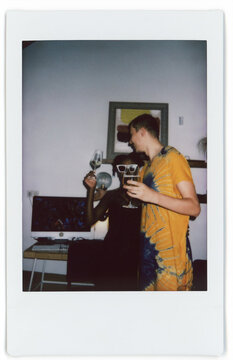 Couple Celebrating With Drinks in a Cozy Indoor Setting