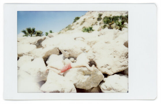Man relaxing at rocky beach 