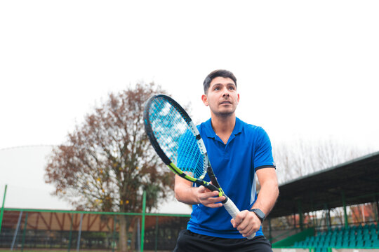 Male Tennis Player Focused Before Returning a Shot