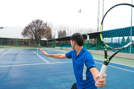 Tennis Player Prepares for Backhand Return During Match