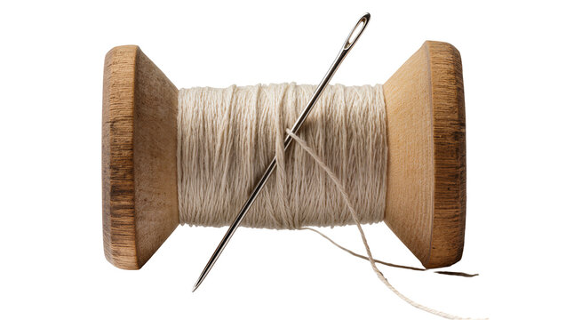 Wooden spool of beige thread with a metal needle, isolated on transparent background