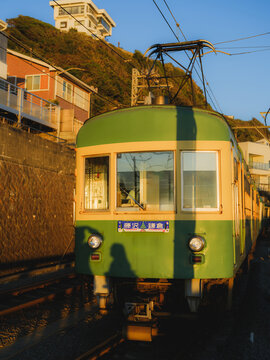 Vintage train that runs along the seaside in Kamakura, Japan 