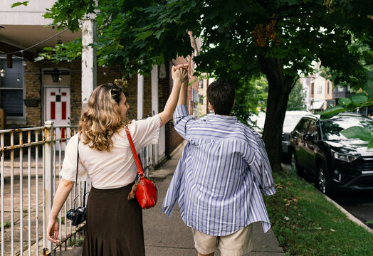 Lesbians Walking down the Street Holding Hands