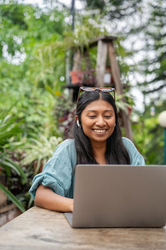 A cheerful young woman working 