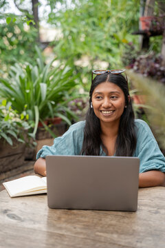 A cheerful young woman working 
