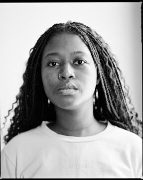 Close up portrait of woman with curly braids