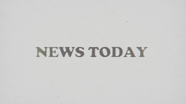 CMYK Halftone Text News Today Printed on Changing Paper with Vintage Stop Motion Effect.