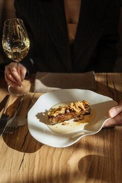 Elegant dish with creamy sauce and white wine served at restaurant tab