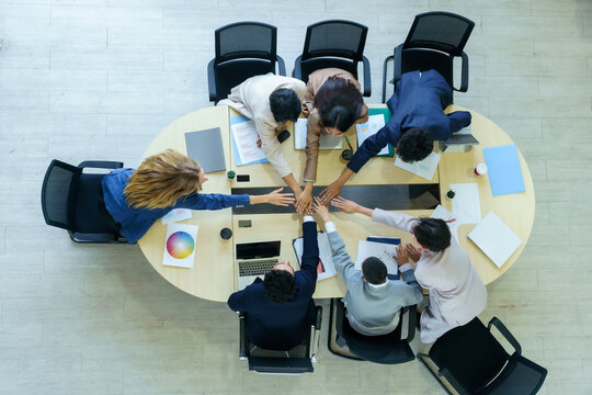 Successful happy workers Group of business people with Multiethnic workers with in company workers Group of asian business people and support Teamwork in the meeting room at modern office.