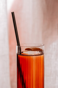 Close-Up of Red Cocktail with Ice and Straw
