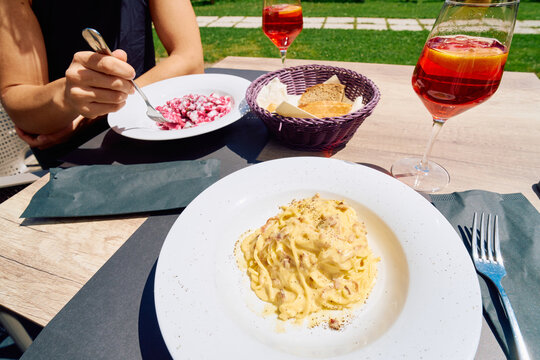 Outdoor Italy summer meal With Fresh Pasta And Spritz 