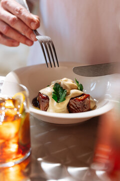Dish of roasted vegetables with sauce and garnish