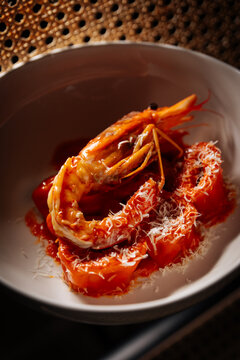  Pasta with prawn and grated cheese in red sauce